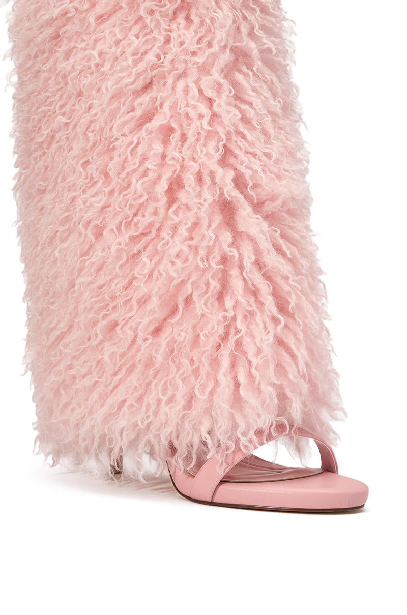 A person wearing wide-legged, fluffy pink pants and AZALEA WANG CLOUD NINE PINK FUR OPEN TOE BOOTS, showing only their lower leg and foot. 5