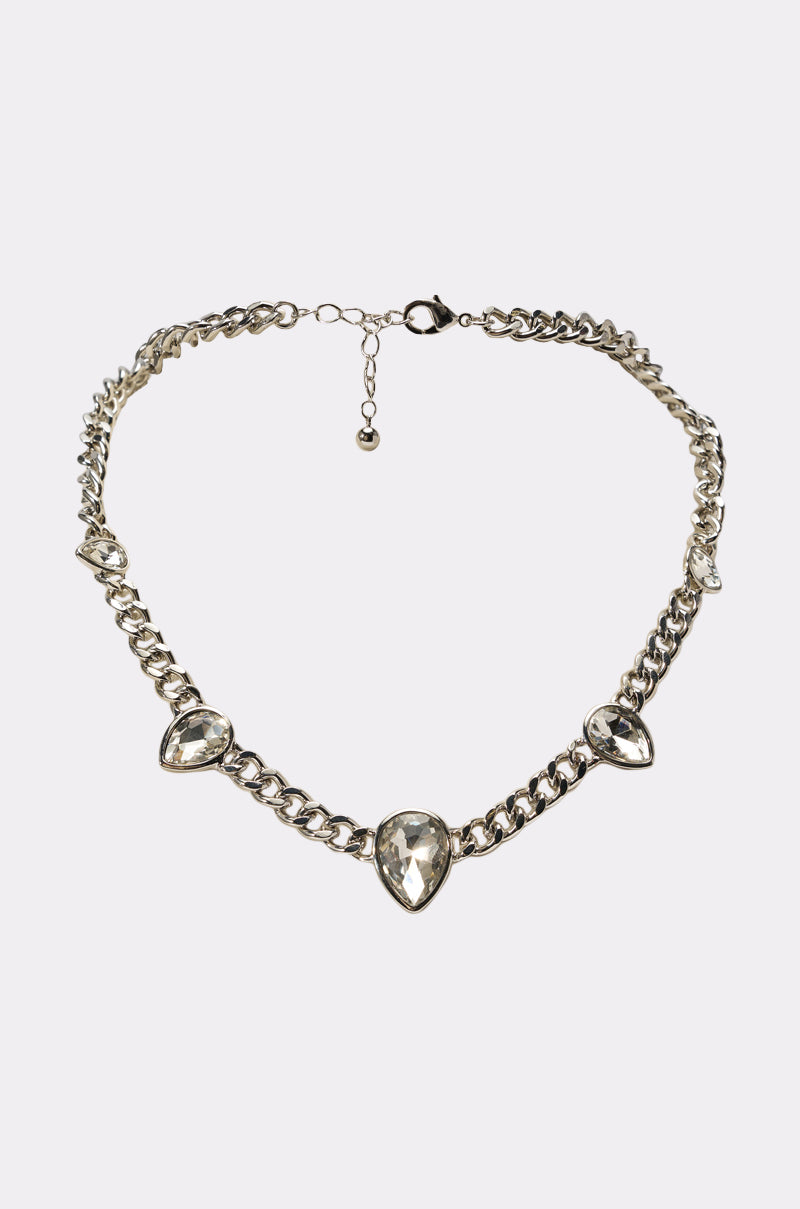 The BESS NECKLACE is a silver chunky chain link necklace with three large teardrop rhinestones spaced along the front and an adjustable clasp closure. 2