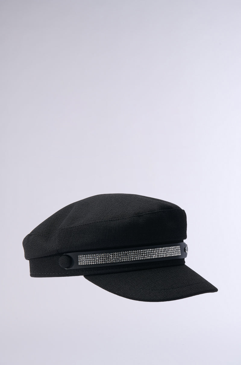 A chic black "ITS GIVING BLING BAKER HAT" with a flat brim and a dazzling rhinestone-embellished band is showcased on a plain, light gray background. 4