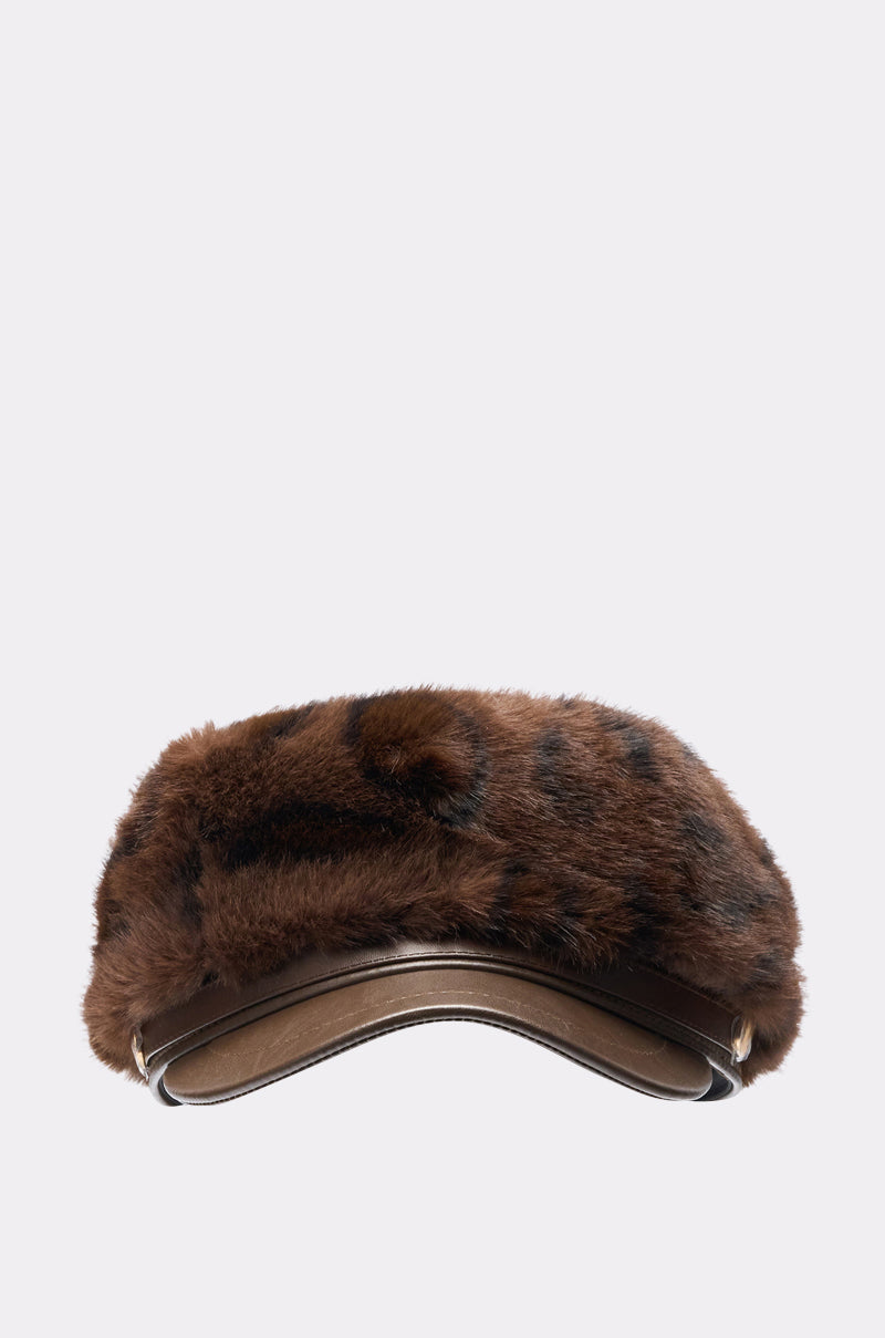 The I AM THE LUXURY FAUX FUR BRIM HAT features soft brown faux fur with dark spots, a velvety texture, and an adjustable band, displayed against a plain light background. 1