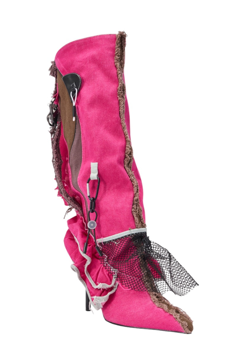 The AKIRA GOLD COALESCE SPORTY MIXED MATERIAL STILETTO BOOT features a bright fuchsia, knee-high denim design with raw frayed edges, black mesh accents, and bold straps for a striking deconstructed streetwear style. 6