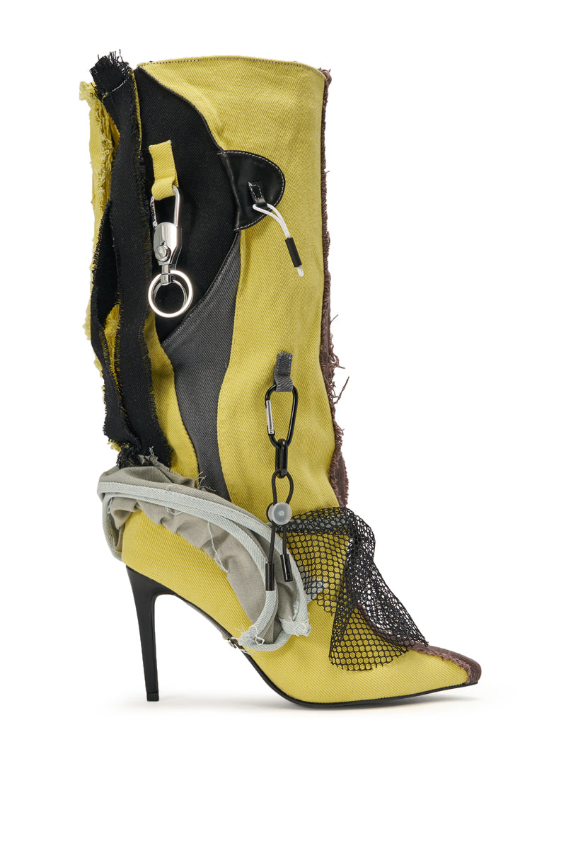 The AKIRA GOLD COALESCE SPORTY MIXED MATERIAL STILETTO BOOT is a yellow, knee-high fabric boot with a stiletto heel, exposed seams, black and gray accents, mesh details, and metal carabiners for an avant-garde, deconstructed look. 2