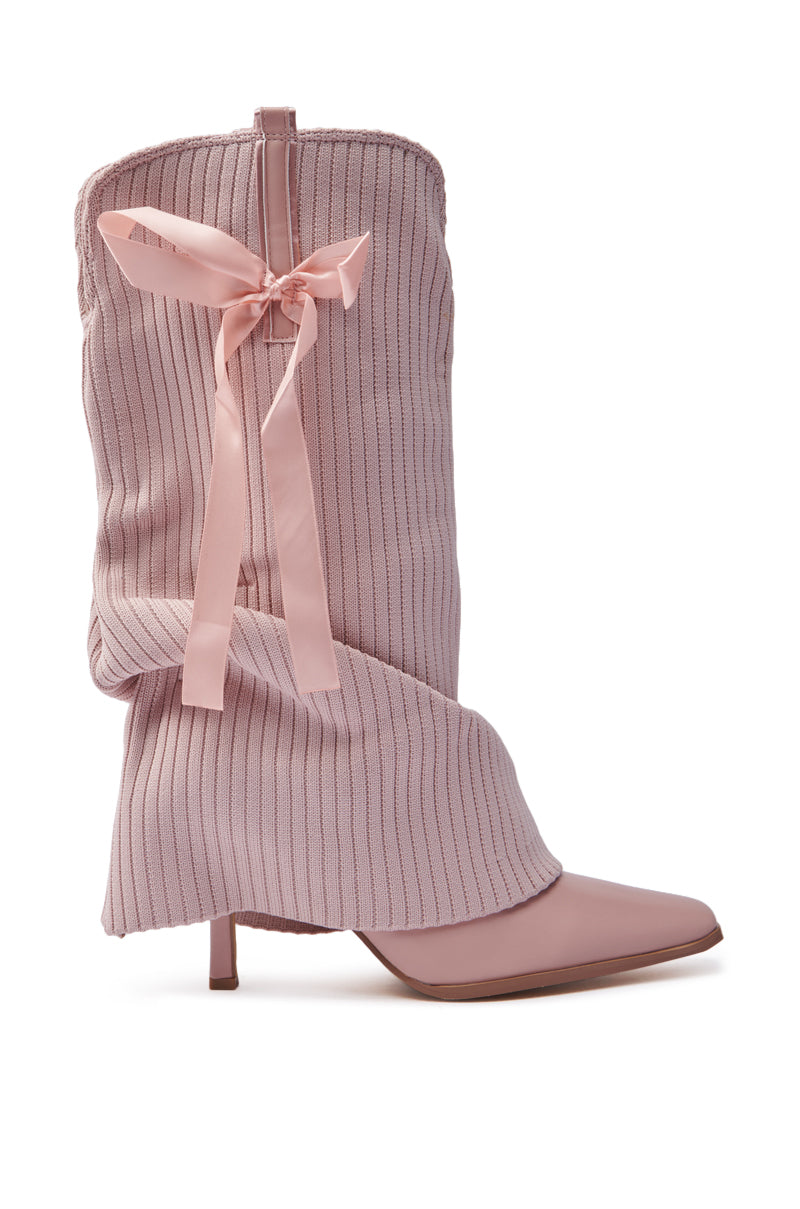The CODEWORDS Pink Bow Stiletto Fold Over Boot features a pointed toe, stiletto heel, vegan leather, ribbed fabric upper with a matching pink bow, offering a charming and stylish modern design.