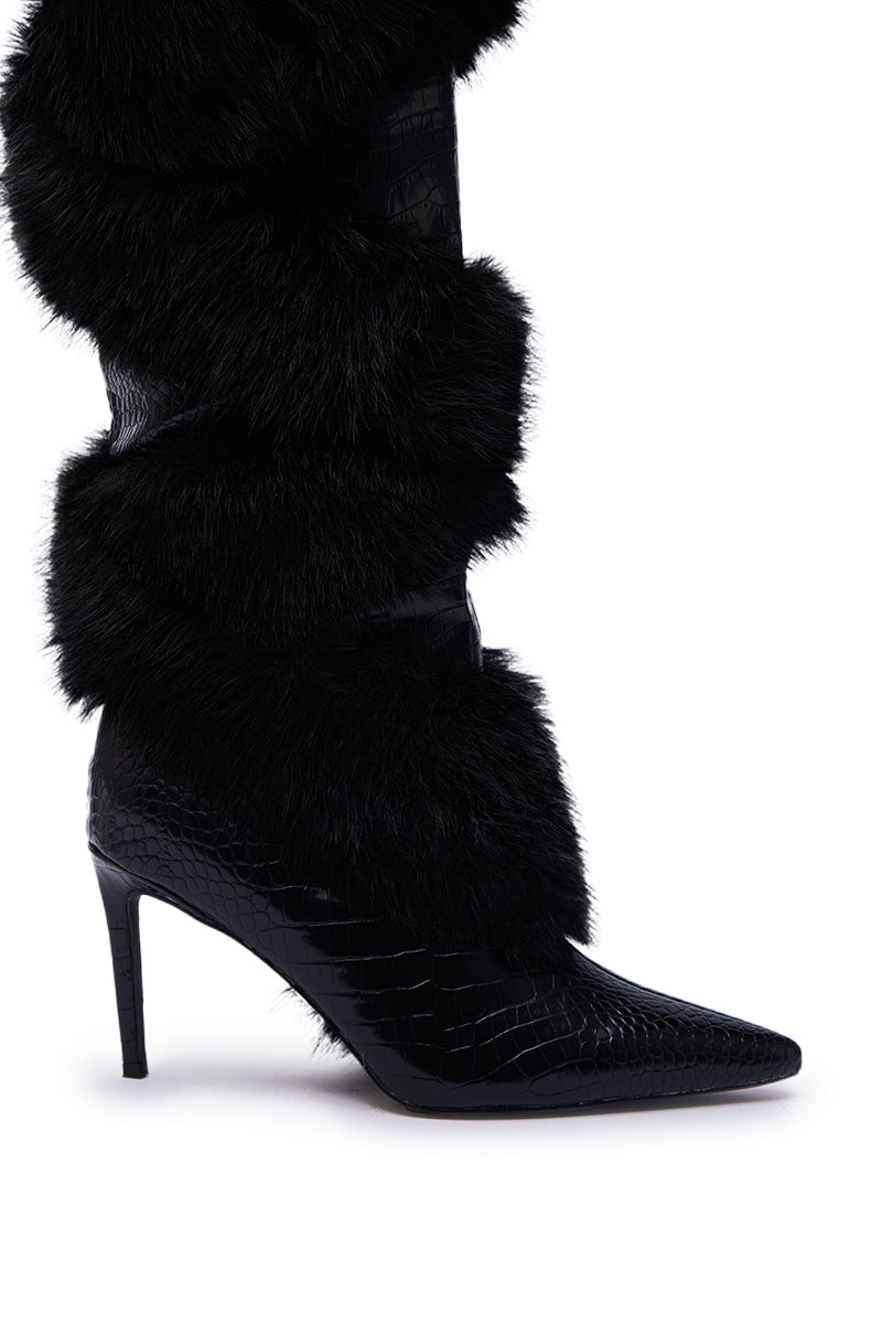 The AZALEA WANG CONRADDE Black Mixed Material Fur and Snake Stiletto Boot features a knee-high, high-heeled design with a pointed toe, faux snake texture, and thick black fur trim on the shaft.