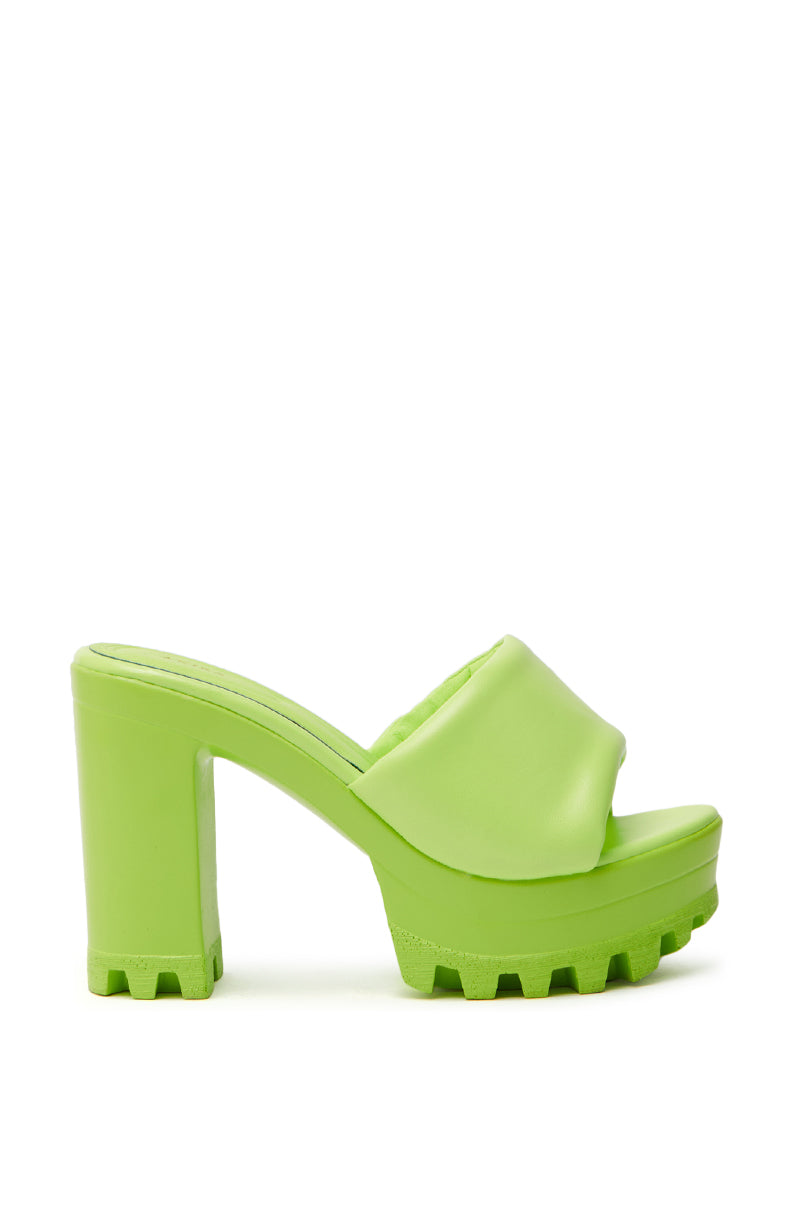 The AZALEA WANG COOL CAT LIME PUFFY PLATFORM SANDAL features a chunky high heel, open toe, and textured sole in bright green. Its comfort cushion insole guarantees stylish ease with each step, offering a bold, trendy appearance.