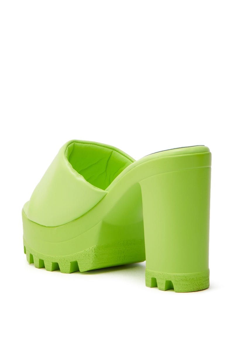 The AZALEA WANG COOL CAT LIME PUFFY PLATFORM SANDAL is displayed from the back, showcasing its vibrant lime color, thick platform sole with ridged tread, chunky heel, and comfort cushion insole for extra ease.