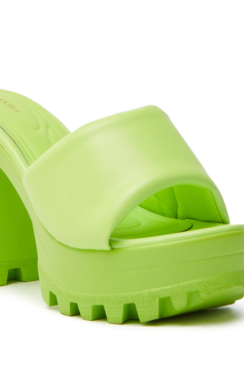 Close-up of the AZALEA WANG COOL CAT LIME PUFFY PLATFORM SANDAL, featuring an open toe with a chunky textured sole. It has a wide front strap, comfort cushion insole, and rugged tread pattern for grip.