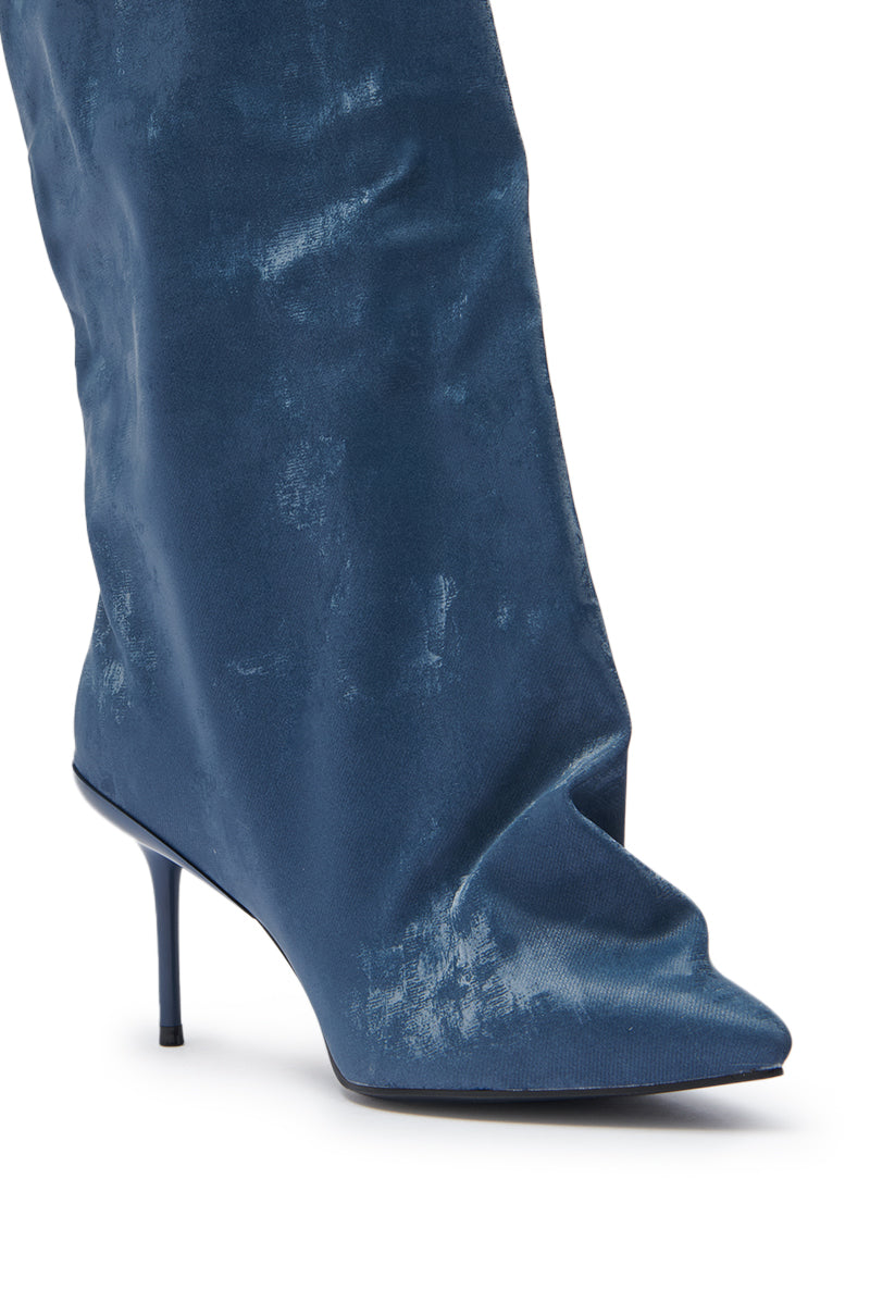 The AZALEA WANG COUTURE CRAZY BLUE LUXE SHINE LOOK BOOT is a blue patent leather stiletto with a slouchy, pointed-toe design, high-shine finish, textured fabric detail, and mid-calf silhouette.