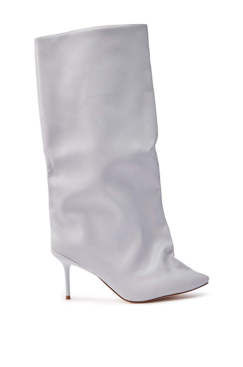 The AZALEA WANG COUTURE CRAZY BONE BOOT is a minimalist, high-heeled boot in light gray faux leather. It features a mid-calf length, pointed toe, and slender stiletto heel against a plain white background.