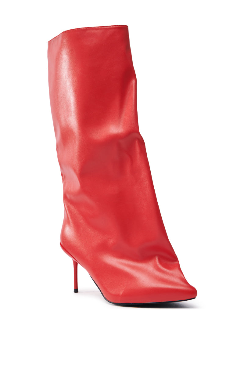 The AZALEA WANG COUTURE CRAZY RED BOOT features a vegan leather, slouchy design with a pointed toe and sleek stiletto heel.
