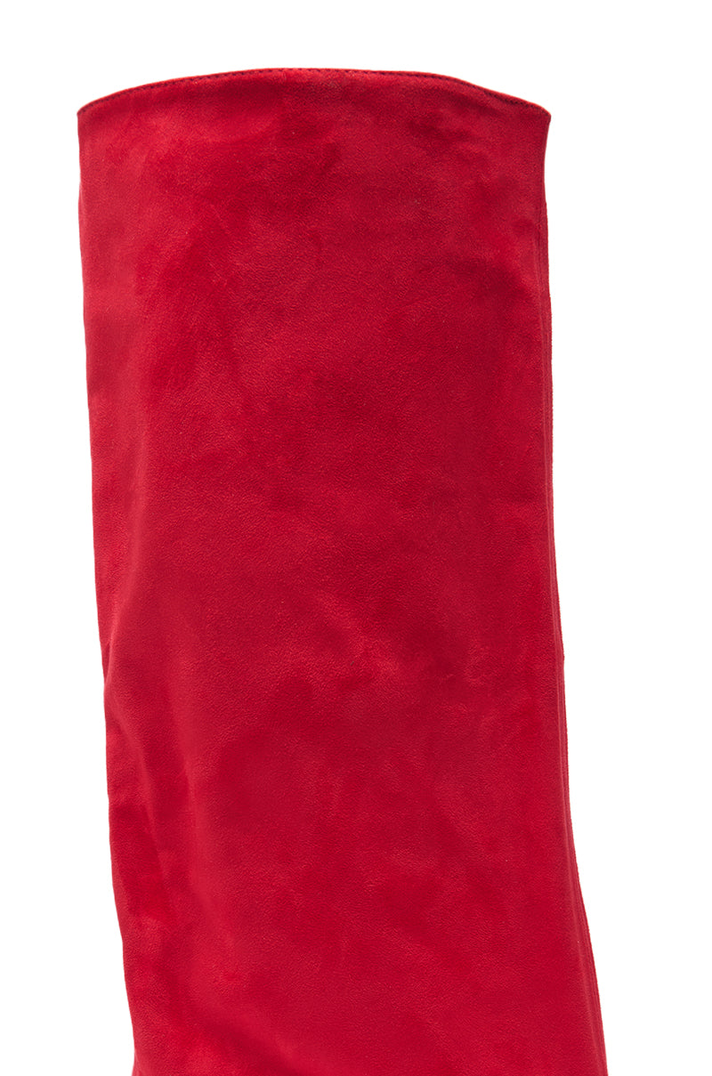 Close-up of the AZALEA WANG COUTURE LURE RED FAUX SUEDE BOOT’s upper, highlighting its vibrant red color, soft texture, and smooth, slightly slouched faux suede surface. 4
