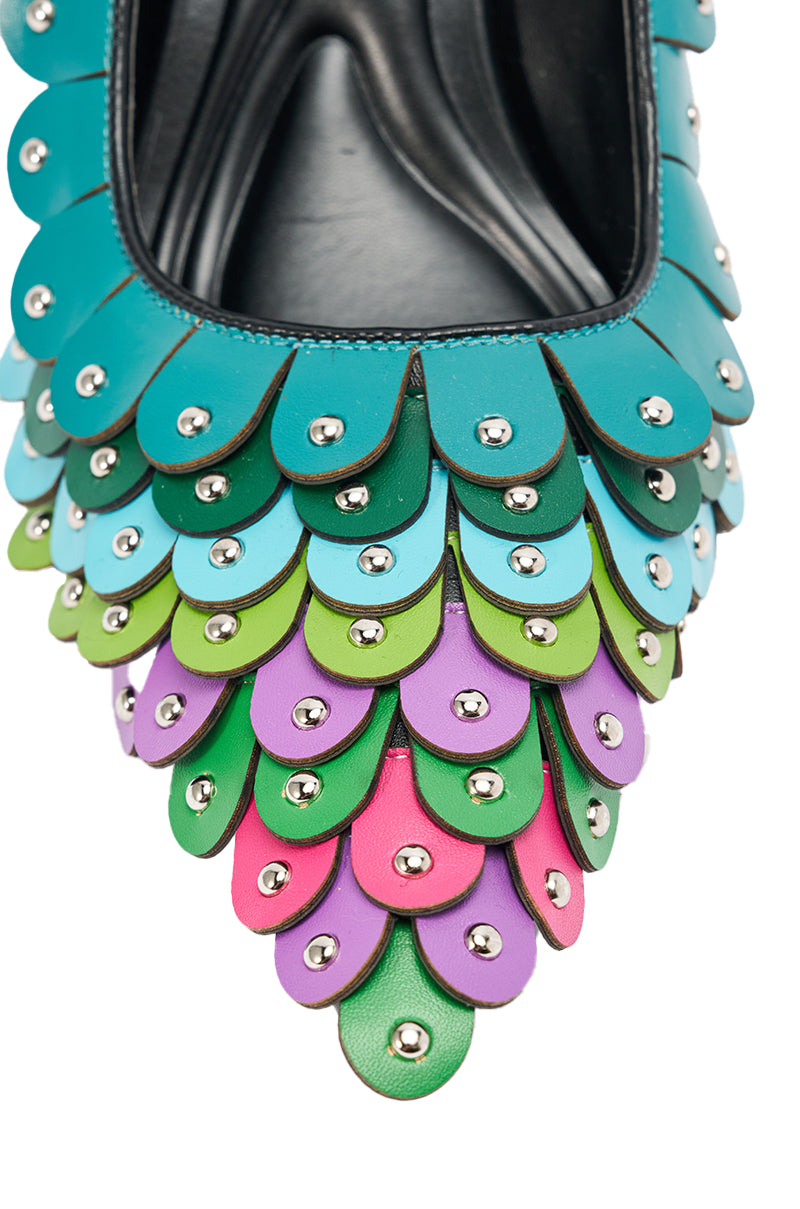 Close-up of the AZALEA WANG CRISTATUS GREEN MULTI COLOR TEXTURED STILETTO PUMP, featuring layered scalloped faux leather in blue, green, purple, and pink with silver studs for a striking fish scale or feather effect.