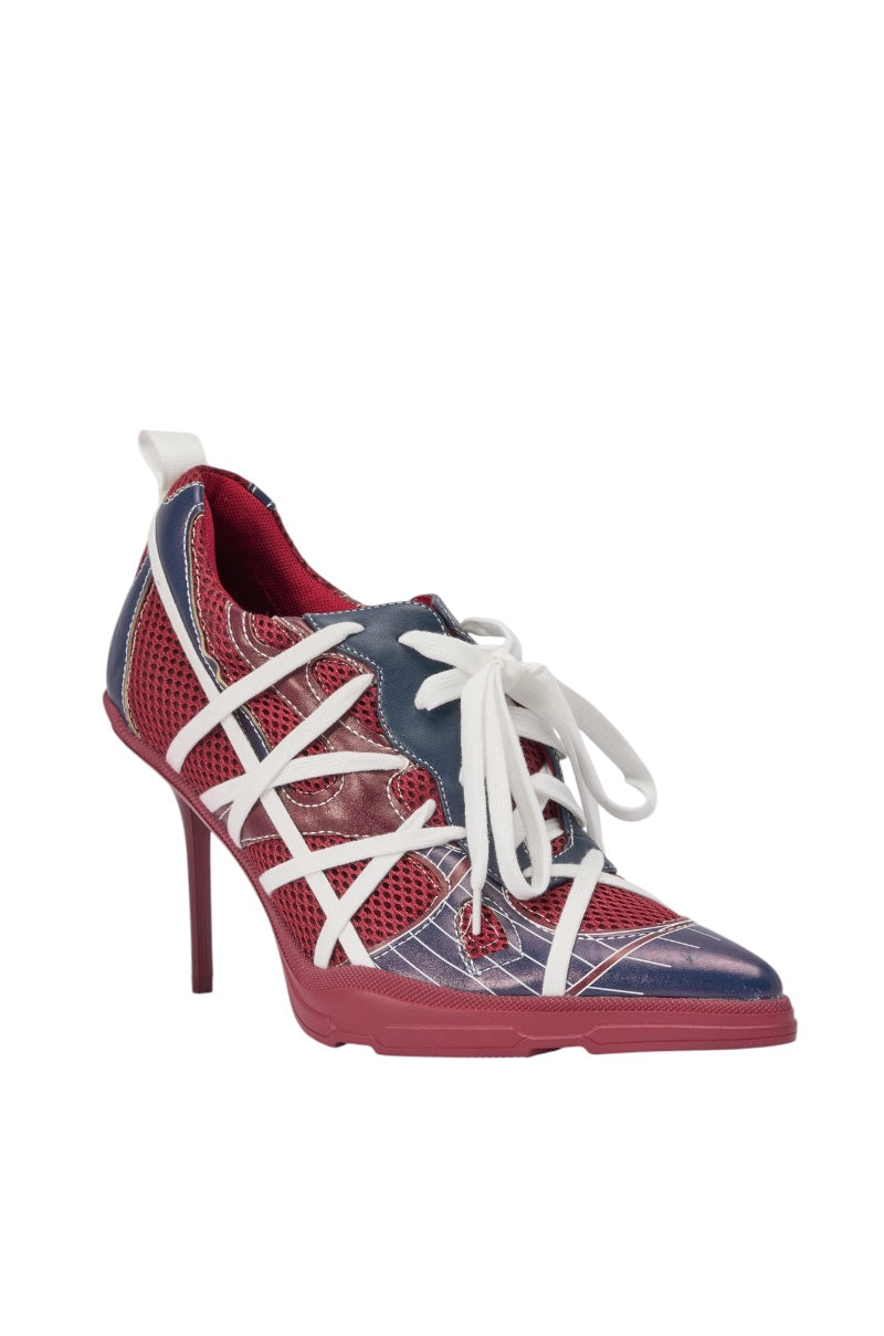 The AZALEA WANG CROSS WALK BURGUNDY STILETTO SNEAKER HEEL features a red sole, mesh blue and red upper, white crisscross straps, and white laces—combining sporty sneaker style with an elegant high heel. 4