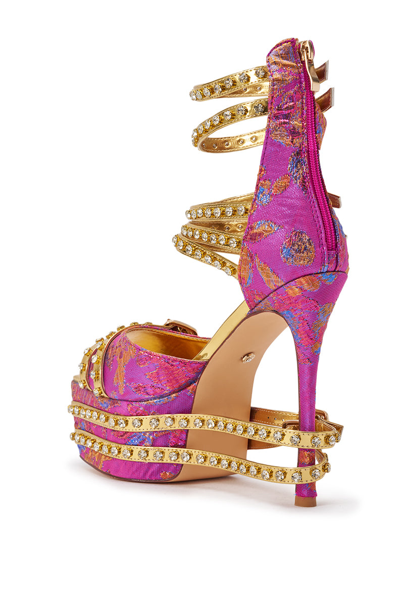The AKIRA CRUSHIN PINK MULTI BROCADE AND GOLD EMBELLISHED STILETTO SANDAL features vibrant pink brocade with gold floral patterns, gold rhinestone spiral straps, and a back zipper for an ornate, luxurious touch. 4