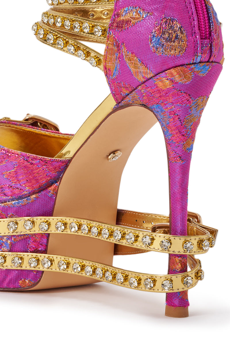 The AKIRA CRUSHIN PINK MULTI BROCADE AND GOLD EMBELLISHED STILETTO SANDAL features a pink brocade platform, gold rhinestone-adorned straps, and a slim stiletto heel for a glamorous touch. 5