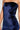 A close-up showcases an individual wearing the LOST YOUR CHANCE Navy Velvet Maxi Dress. The strapless design, combined with its body-hugging silhouette and light-reflecting smooth fabric, exudes elegance. The image beautifully highlights the torso and upper arm areas, capturing the sophistication of this exquisite ensemble.