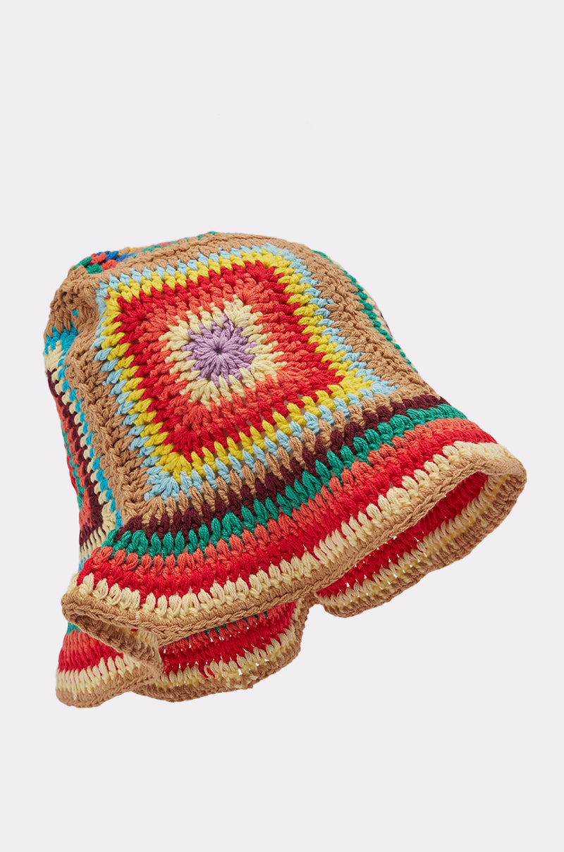The NEUTRAL VIBES CROCHET BUCKET HAT is a hand-crocheted bucket hat with a colorful granny-square design and wavy floppy brim, offering a textured patchwork look—ideal as a playful beach accessory. 5