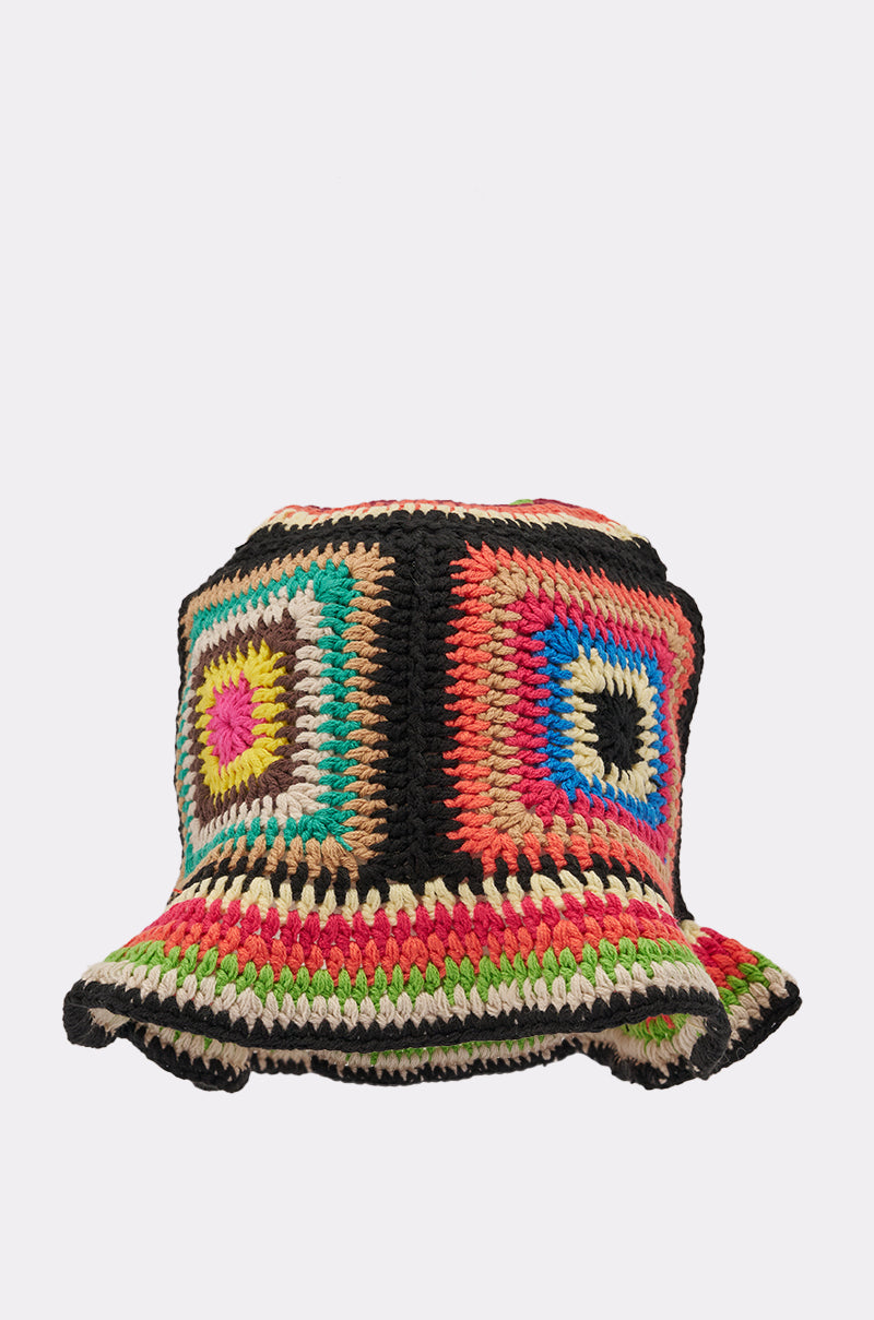 The DND CROCHET BUCKET HAT features bold geometric patterns in black, red, green, pink, yellow, blue, and beige yarn with a slightly wavy brim—perfect for adding vibrant retro style to any outfit. 3
