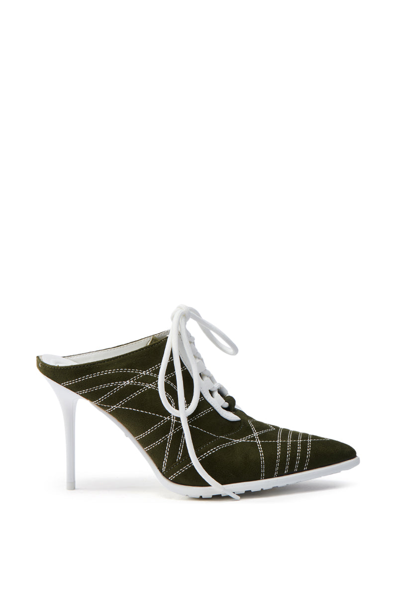 The AZALEA WANG DALARY GREEN STILETTO PUMP features a stylish pointed toe, dark green faux suede upper, and crisscrossing white laces with white stitching, adding flair to its sleek, modern design.