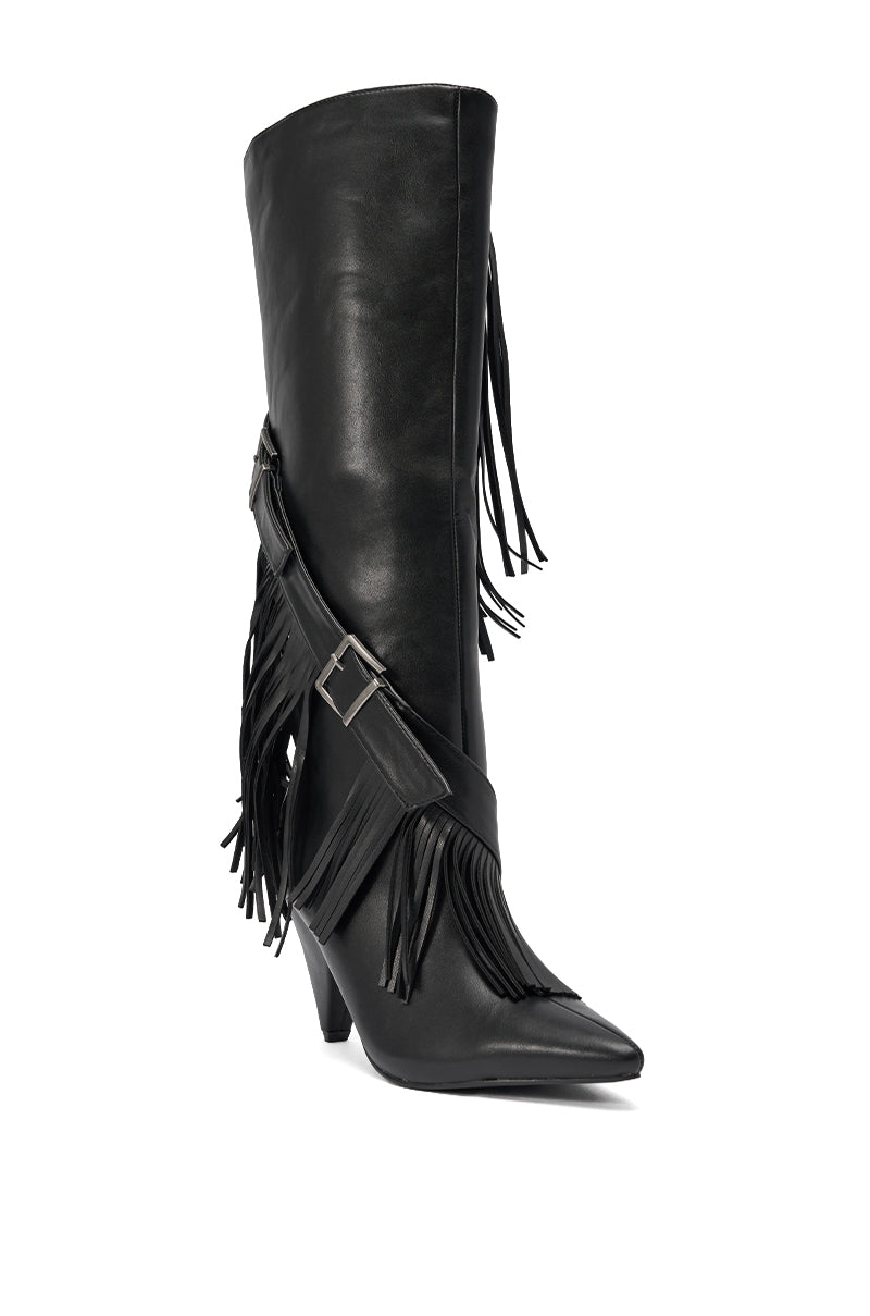 The AZALEA WANG DARELLE BLACK FRINGE BOOT is a black, knee-high western-inspired faux leather boot featuring a pointed toe, mid-angled heel, fringe details, and a decorative buckle strap at the ankle. 5