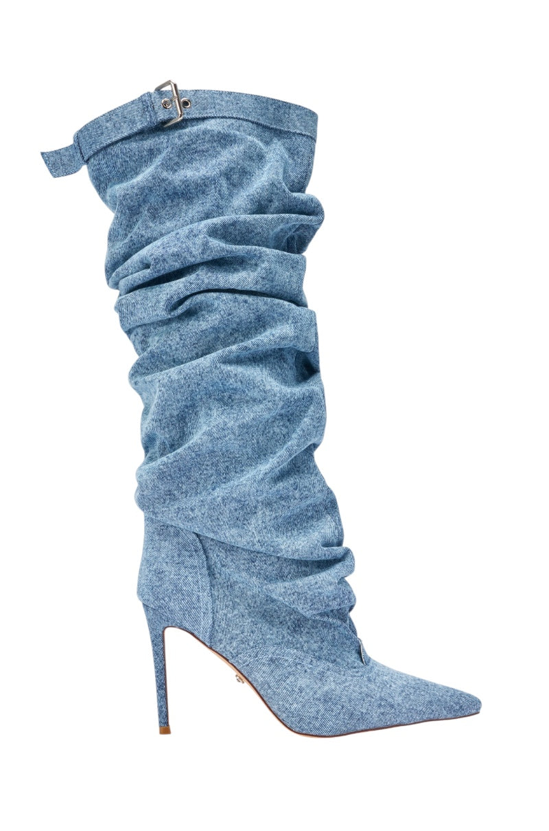 The AZALEA WANG DARIA DENIM STILETTO BOOT is a single high-heeled, pointed-toe slouchy light blue denim boot featuring a decorative strap and buckle near the top. 3