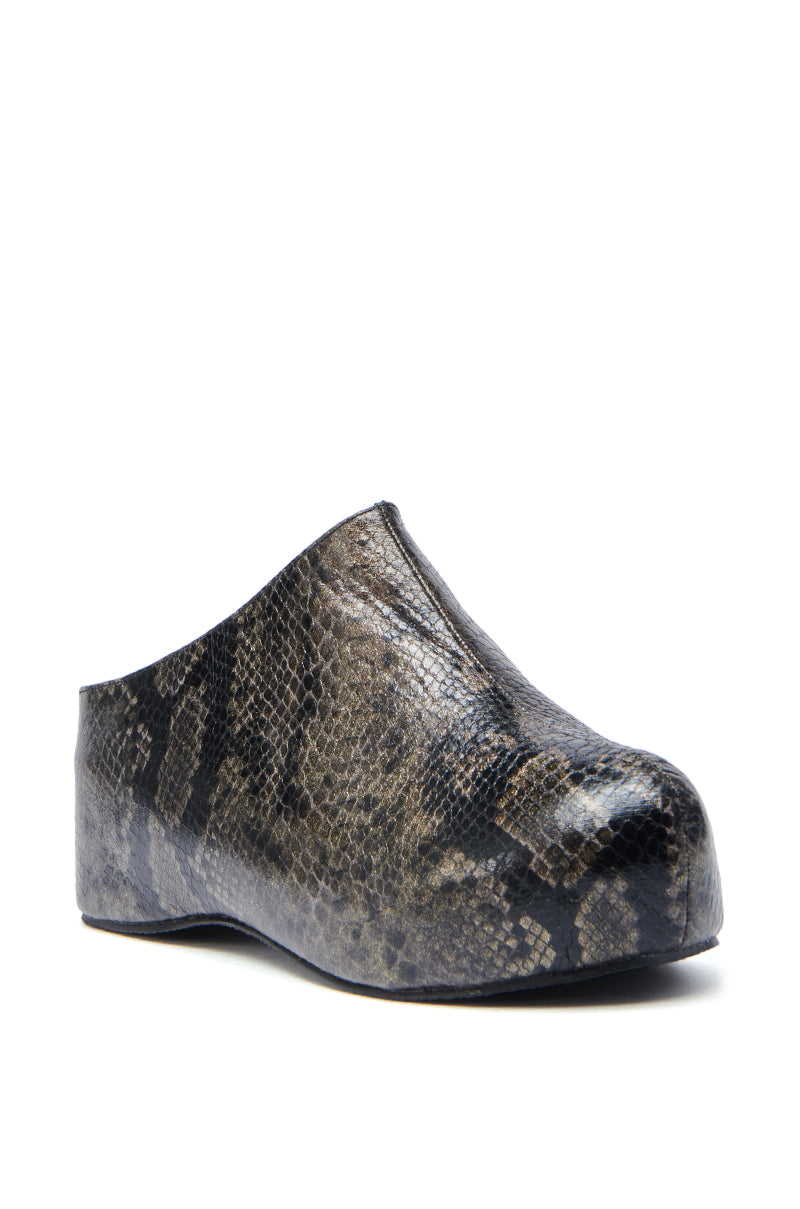 The AZALEA WANG DARWIN CLOG IN BLACK SNAKE is a slip-on faux leather shoe featuring a closed toe, black snakeskin finish, and low flat sole for stylish comfort.