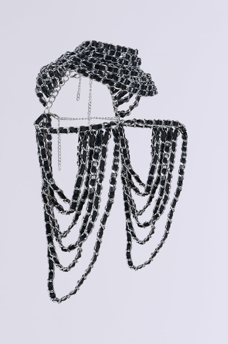A metallic silver chain sculpture resembling a hat and mask is crafted from black and silver links, producing a draped, intricate design against a plain background—an artistic piece reminiscent of the KYKY Statement Necklace. 4