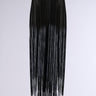 The SO FREE FRINGE BELT SKIRT features a long black design adorned with cascading fringe detailing from the elasticated wide waistband to the hem, creating a flowing and dynamic texture. The skirt's design stands out against a plain, light-colored background.