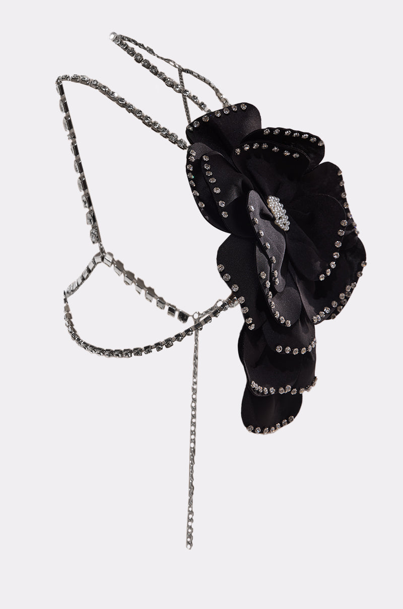 The LET ME BLOOM BODY CHAIN features silver chains with rhinestones and a large black fabric flower accented with rhinestones, creating striking floral body jewelry. 7