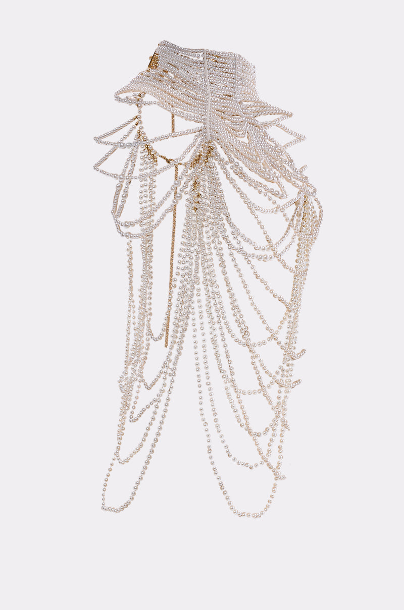 The FEELIN DEMURE BODY CHAIN is a striking layered choker featuring cascading strands of small faux pearls and gold chains, forming an intricate, sculptural design against a plain white background. 4