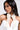 A woman wears a white strapless top and the BUTTONED UP PEARL COLLAR, facing left against a plain light background.