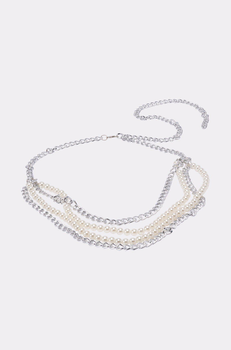 A BELT featuring layered silver chains and strands of white pearls, displayed against a plain light gray background—an elegant statement accessory for any occasion. 3
