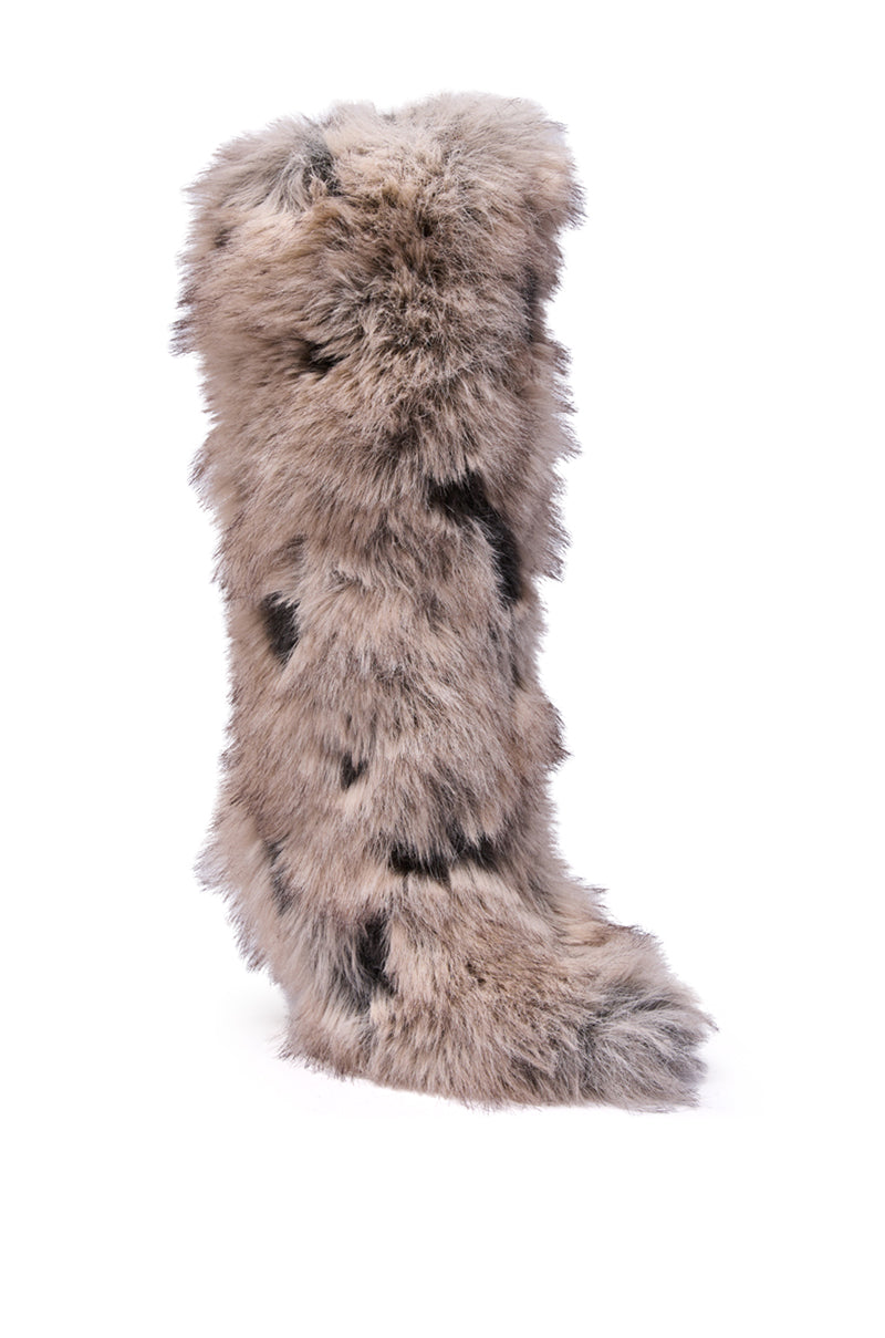 The AZALEA WANG DEBBY GREY MULTI FUR STILETTO BOOTIE is a knee-high stiletto featuring thick, light brown fur with dark spots and a pointed toe, displayed upright against a white background.