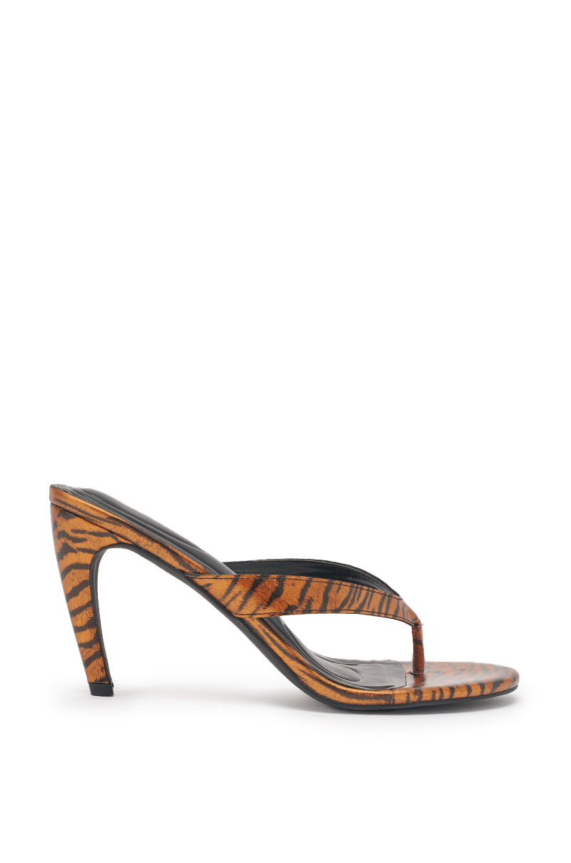 The AKIRA GOLD DELYSE ORANGE TIGER PRINT PU Slip On Stiletto Sandal features a thong strap, comfort cushion insole, and is styled for flair. Shown in side profile against a white background. 4