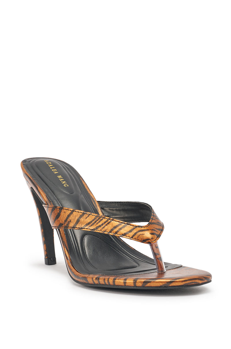 The AKIRA GOLD DELYSE ORANGE TIGER PRINT PU Slip On Stiletto Sandal features tiger print PU straps, a cushioned footbed, and a thong toe design for added flair and comfort. 5