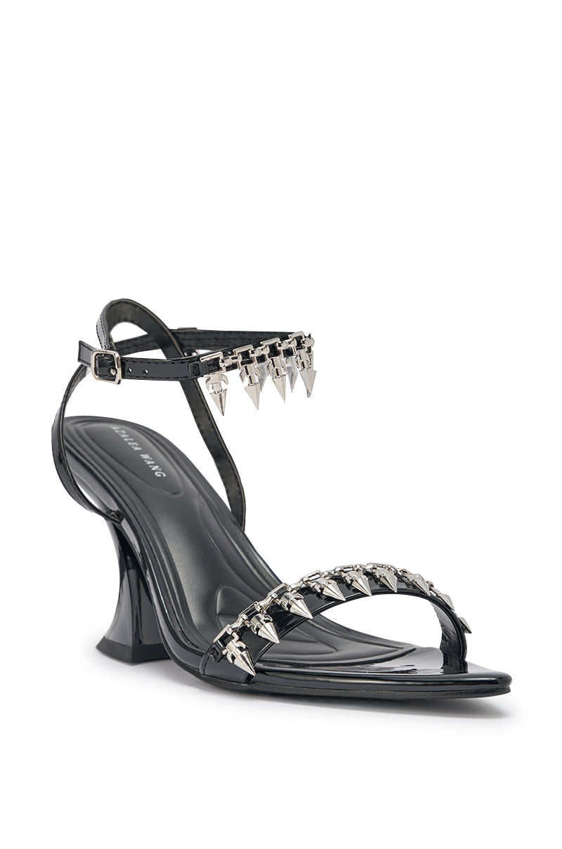 The AKIRA Gold Demise Sandal features chunky straps, silver hardware embellishments on the ankle and toe straps, and a sleek modern design for a bold statement look. 5
