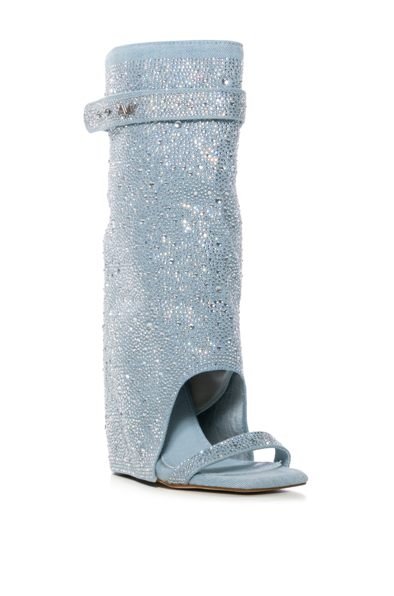 The AZALEA WANG DESARAY is a single light blue knee-high denim sandal bootie adorned with sparkling rhinestones, featuring an open toe, ankle strap, and chunky wedge heel for a glamorous look.