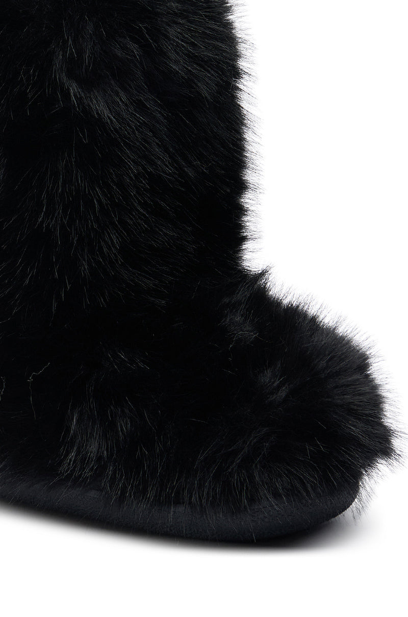 Close-up of the AZALEA WANG DIPA BLACK FUR FLAT BOOTIE with a rounded toe, featuring prominent black faux fur covering the entire flat bootie, set against a white background.