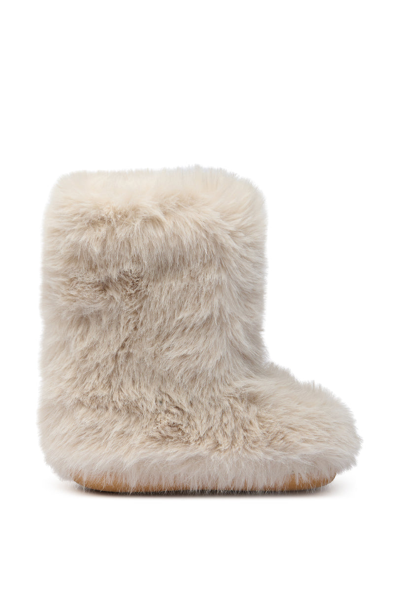 The AZALEA WANG DIPA IVORY FUR FLAT BOOTIE is a light beige bootie with soft faux fur texture and a flat sole, shown in profile against a white background.