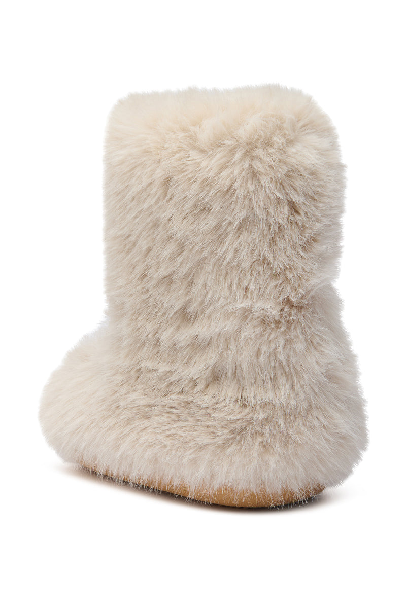 The AZALEA WANG DIPA IVORY FUR FLAT BOOTIE is displayed against a white background, showcasing its plush, fluffy texture and flat sole for cozy comfort.