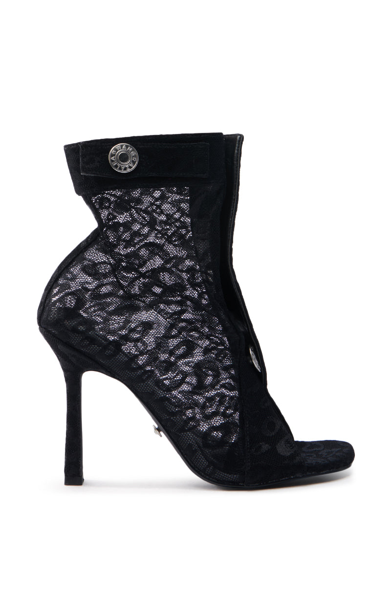 The AZALEA WANG DOROTHY BLACK STILETTO BOOTIE is a high-heeled open-toe bootie featuring intricate black lace mesh, a slim stiletto heel, and a decorative button for a blend of elegance and modern flair.
