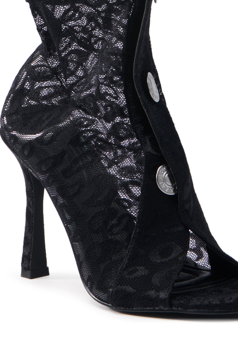 Close-up of the AZALEA WANG DOROTHY BLACK STILETTO BOOTIE with lace texture, a decorative silver button, open-toe design, and intricate mesh textile patterns for an elegant look.