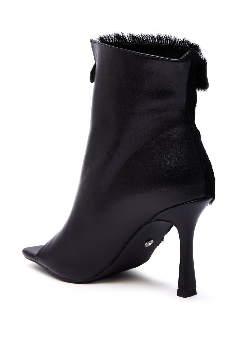 The AZALEA WANG DORTHANDRA Black Pony Hair Paneled Open Toe Bootie features a high heel, pointed toe, smooth leather finish, flared stiletto heel, and textured top edge for a chic, stylish look. 6
