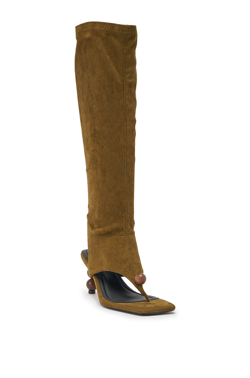 The AZALEA WANG DOTTIE Olive Stretch Faux Suede Boot features a knee-high fit, open thong sandal design, square toe, and an embellished heel with unique toe hardware accents. 4