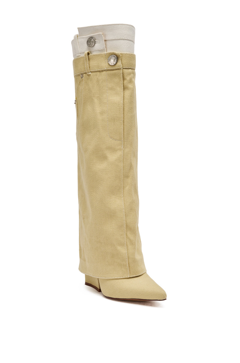 The AZALEA WANG DOUBLE FLY BEIGE CHUNKY BOOT is a knee-high denim boot with a beige canvas outer, pointed toe, low block heel, decorative white and silver buttons at the top, and a folded white fabric detail at the upper edge. 4