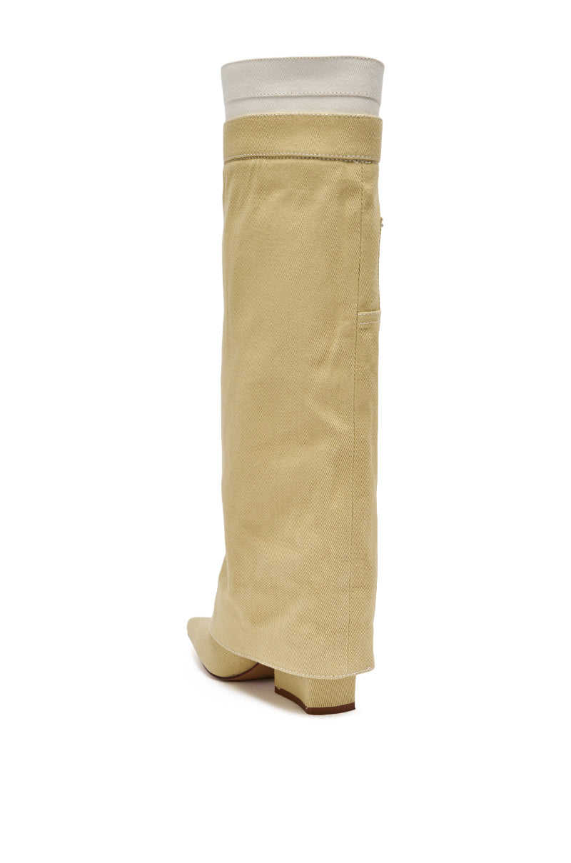 The AZALEA WANG DOUBLE FLY BEIGE CHUNKY BOOT features a pointed toe, flat heel, and a folded white cuff at the top, standing out against a white background. 5