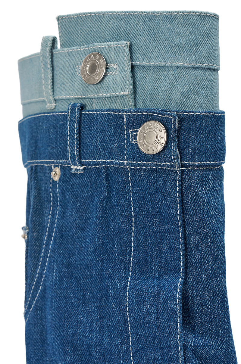Two pairs of blue denim jeans, one light and one dark, are stacked with aligned waistbands and silver buttons, highlighting their contrast—perfect for styling with the AZALEA WANG DOUBLE FLY DENIM CHUNKY BOOT.