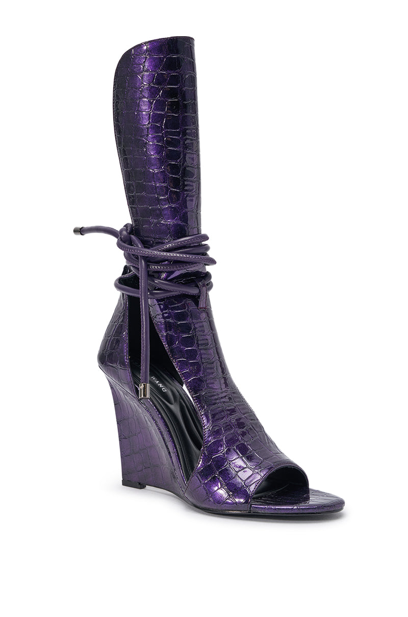 The AZALEA WANG DOUMA PURPLE CROC WEDGE SANDAL is a knee-high, open-toe wedge in purple faux leather with a croc-embossed finish, front cutout, and chic wraparound ankle ties for extra flair. 3