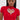 A woman with straight, long dark hair and large hoop earrings wears the HEART YOU TEE IN RED, a fitted short-sleeve red cropped sweater featuring a heart-shaped cutout outlined in rhinestone sparkle.