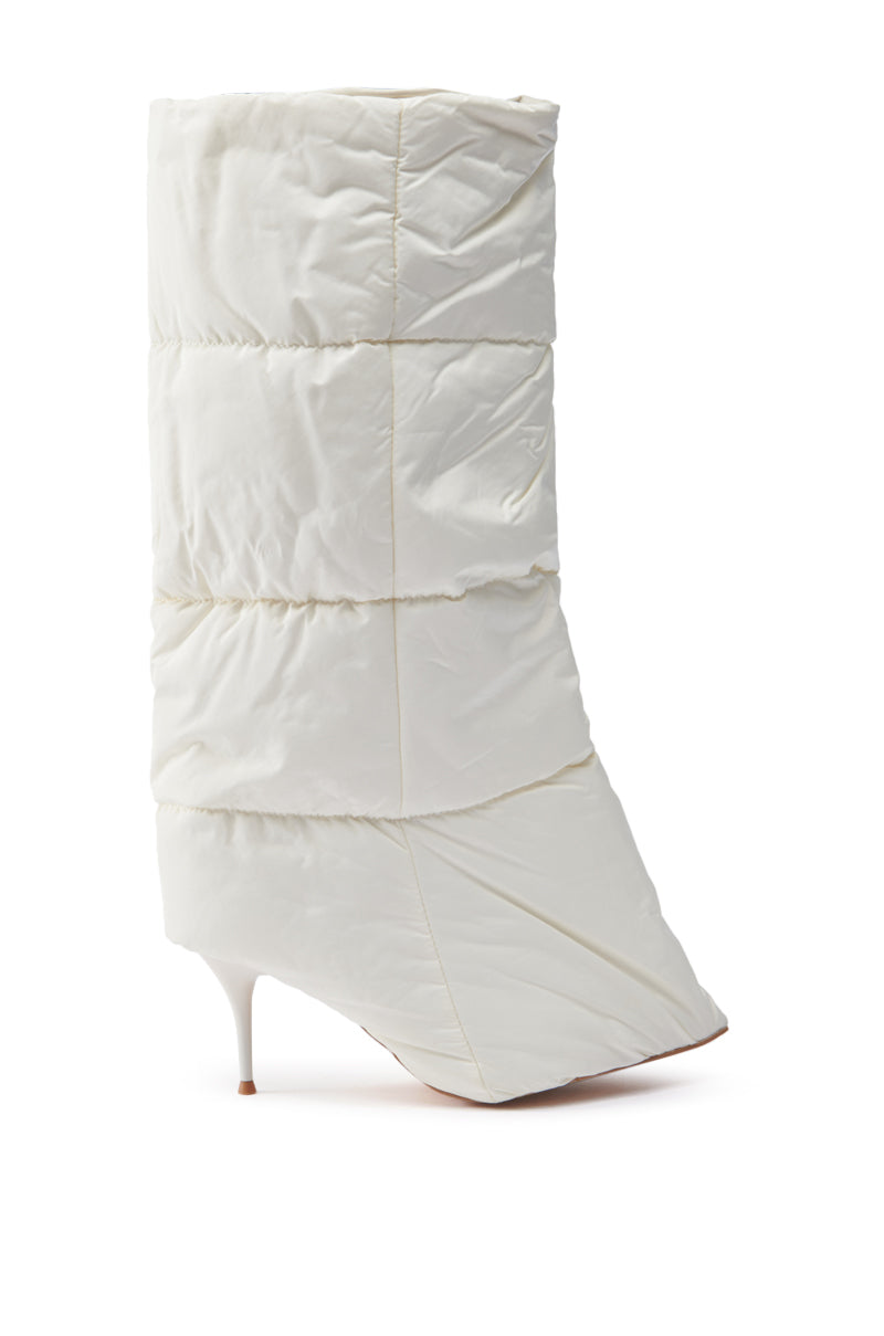 Introducing the DREAMSICLE CREAM PUFFER STILETTO BOOT: a chic white stiletto boot featuring a quilted upper, pointed toe, and slender heel. This boot offers a soft, winter-ready aesthetic with its sculptural silhouette, ideal for sophisticated cold-weather fashion.